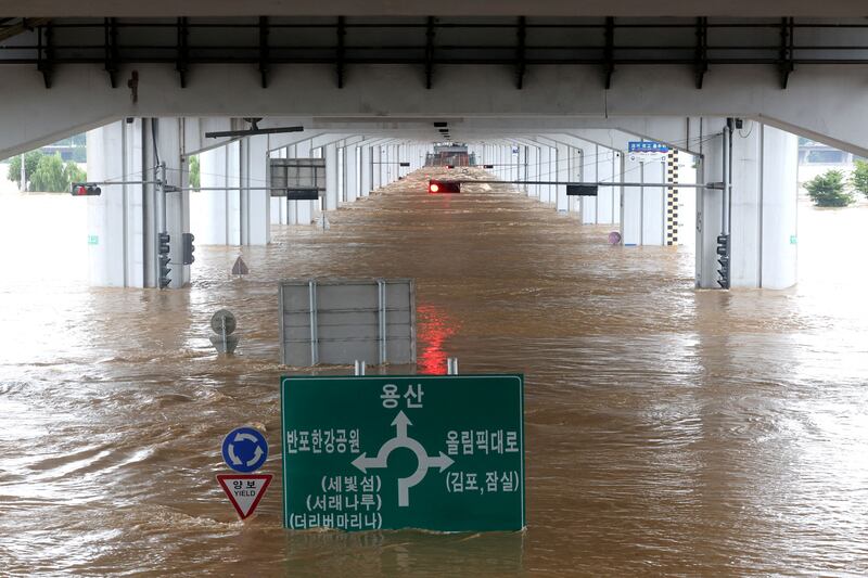 A bridge is submerged by torrential rain at the Han river in Seoul, South Korea. Reuters