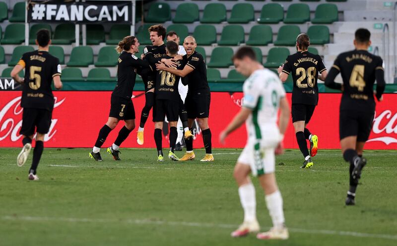 Riqui Puig celebrates with Antoine Griezmann, Martin Braithwaite and team mates after scoring. Getty