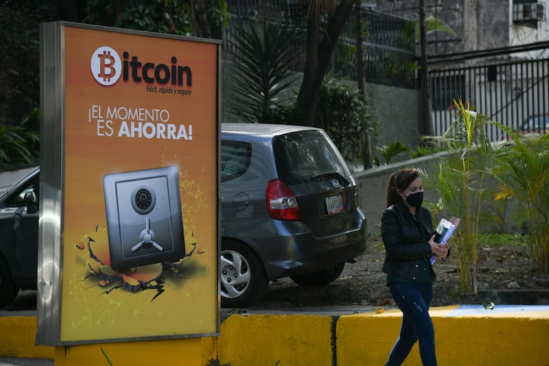 A billboard promoting the use of Bitcoin in Caracas, Venezuela. Cryptocurrency is now seen by many observers as the saviour of the Venezuelan economy, which is experiencing hyperinflation. Bloomberg