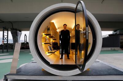 Architect James Law poses inside of his work, "Opod", a 120-square-ft giant water pipes, designed as micro-housing in Hong Kong, China December 14, 2017. Picture taken on December 14, 2017. REUTERS/Tyrone Siu - RC120FE72920