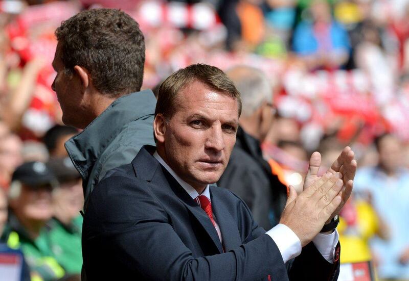 Liverpool manager Brendan Rodgers applauds during his side's Premier League season opening win over Southampton. Paul Ellis / AFP / August 17, 2014