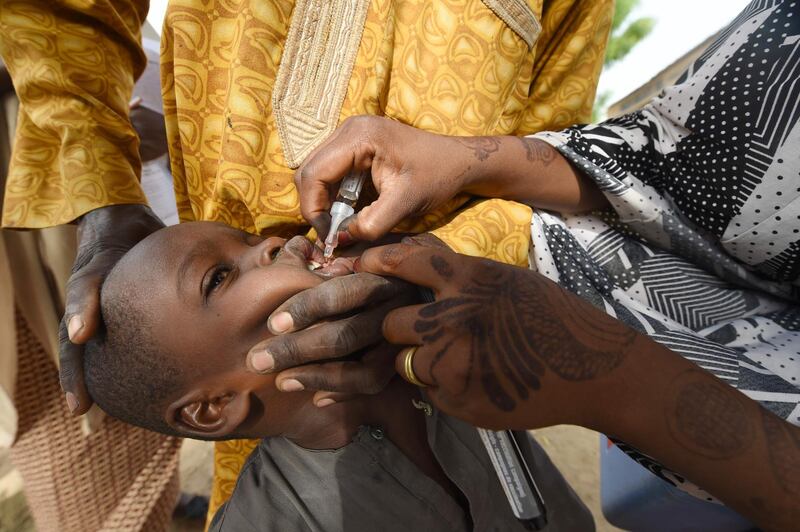A Health worker administers a vaccine to a child during a vaccination campaign against polio at Hotoro-Kudu, Nassarawa district of Kano in northwest Nigeria. AFP