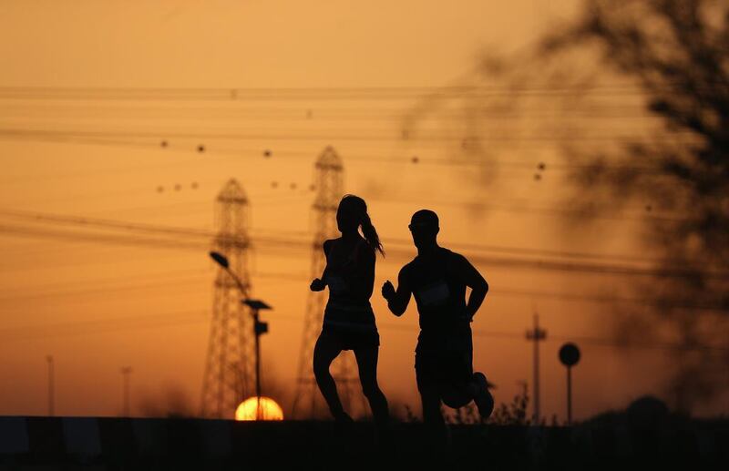 Competitors take part in the Wings for Life World Run during sunset at Nad Al Sheba Cycle Park on Sunday in Dubai. Francois Nel / Getty Images / May 4, 2014