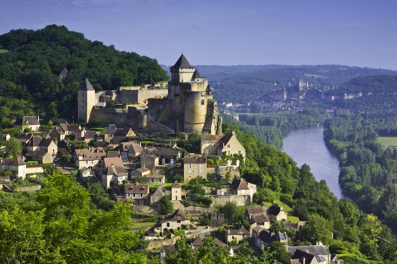 Château de Castelnaud-la-Chapelle in Sarlat-la-Canéda. The hillsides of this area of the Dordogne region are filled with chateaux, ancient villages and lush gardens. Corbis Documentary / Getty Images / Phocal Media