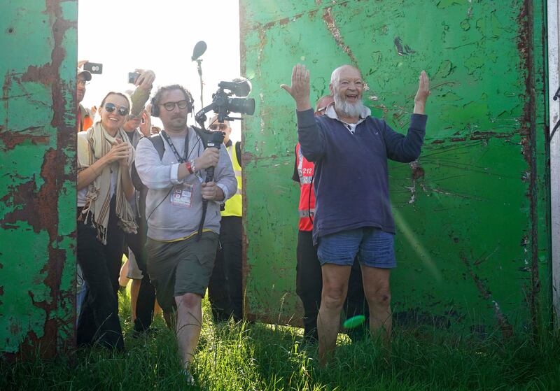 Eavis, right, and his daughter Emily, left, open the Glastonbury gates. AP