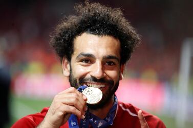 Soccer Football - Champions League Final - Tottenham Hotspur v Liverpool - Wanda Metropolitano, Madrid, Spain - June 1, 2019 Liverpool's Mohamed Salah celebrates with his medal after winning the Champions League Final REUTERS/Carl Recine