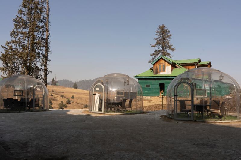 Syntactic chambers, colloquially known as plastic igloos, introduced by Kolahoi Green Heights Hotel in 2023 for outdoor snow dining are doing slow business. Wasim Nabi for The National