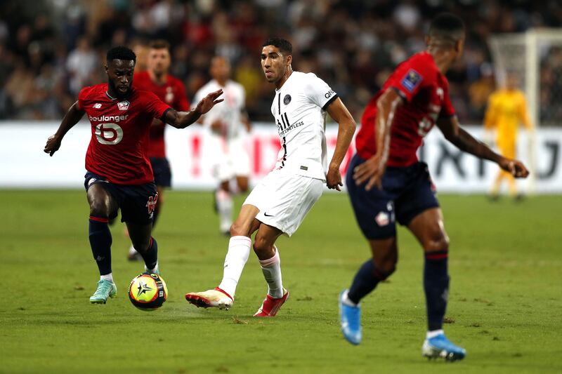 Jonathan Bamba of Lille in action against Achraf Hakimi at the Bloomfield Stadium.