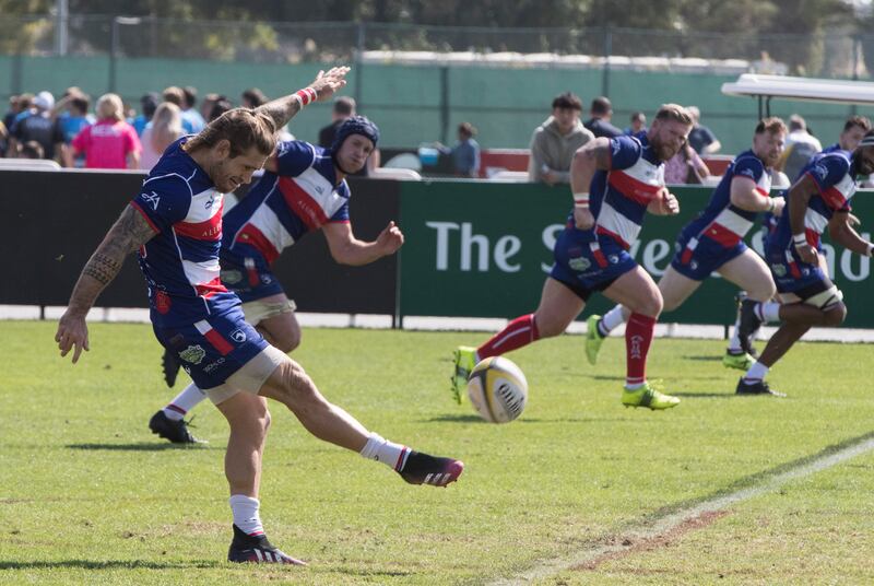 Dubai Hurricanes (grey/white shirts) take on Jebel Ali Dragons at The Sevens Stadium in Dubai. Ruel Pableo for The National