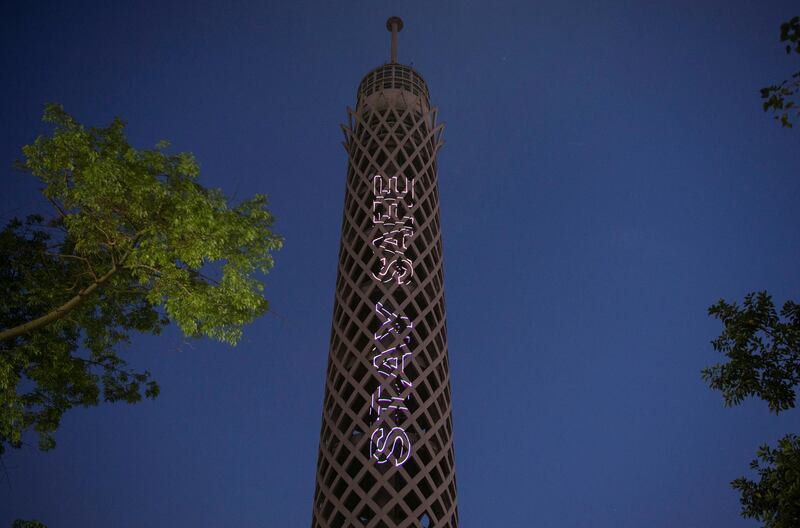 The Cairo Tower lights up with text encouraging Egyptians to stay home and safe, in Cairo, Egypt. EPA