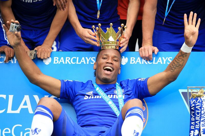 Chelsea's Didier Drogba celebrates with the lid of the Premier League trophy in 2015. PA