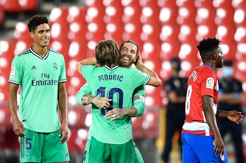 Sergio Ramos, second right, celebrates Real Madrid's victory over Granada with Luka Modric. AP Photo