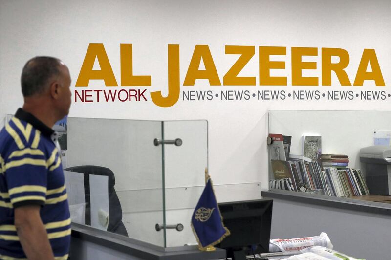 Employees of Qatar based news network and TV channel Al-Jazeera are seen at their Jerusalem office on July 31, 2017,
Israel said on August 6, 2017 that it planned to close the offices of Al-Jazeera after Prime Minister Benjamin Netanyahu accused the Arab satellite news broadcaster of incitement.
A statement from the communications ministry said it would demand the revocation of the credentials of journalists working for the channel and also cut its cable and satellite connections. / AFP PHOTO / AHMAD GHARABLI