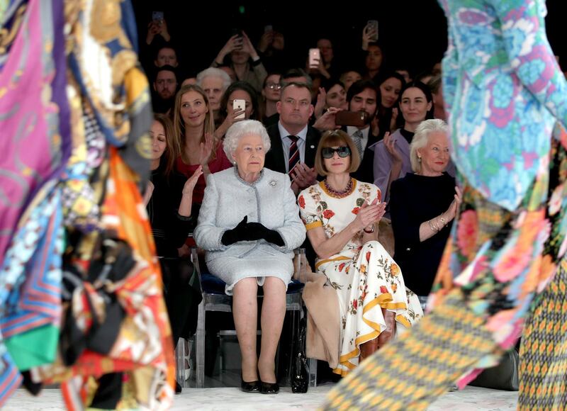 Vogue Editor-in-Chief Anna Wintour showed her commitment to wearing sunglasses indoors by maintaining her signature look even when sitting next to Great Britain's Head of State. Reuters
