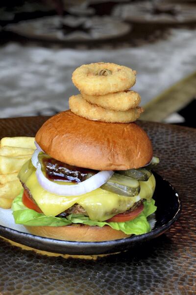 We'll take our burger stacked with onion rings, thanks. Courtesy The St Regis Abu Dhabi 