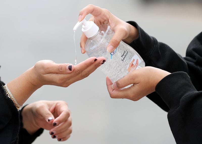 Dubai, United Arab Emirates - Reporter: N/A: Standalone. A family member puts hand sanitiser on their hands. Tuesday, March 24th, 2020. Dubai. Chris Whiteoak / The National