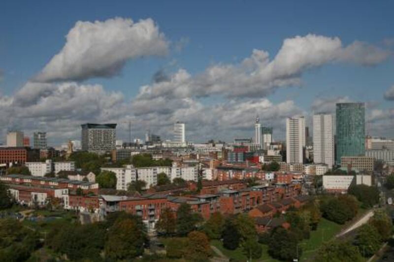 Residential properties sit against a backdrop of the Birmingham city skyline in Birmingham, U.K., on Wednesday, Oct. 6, 2010. Planned cuts to U.K. public spending will hurt office markets such as Birmingham and Liverpool the most. Photographer: Chris Ratcliffe/Bloomberg *** Local Caption ***  744850.jpg