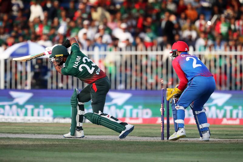 Bangladesh batter Mohammad Naim is bowled by Mujeeb Ur Rahman of Afghanistan.