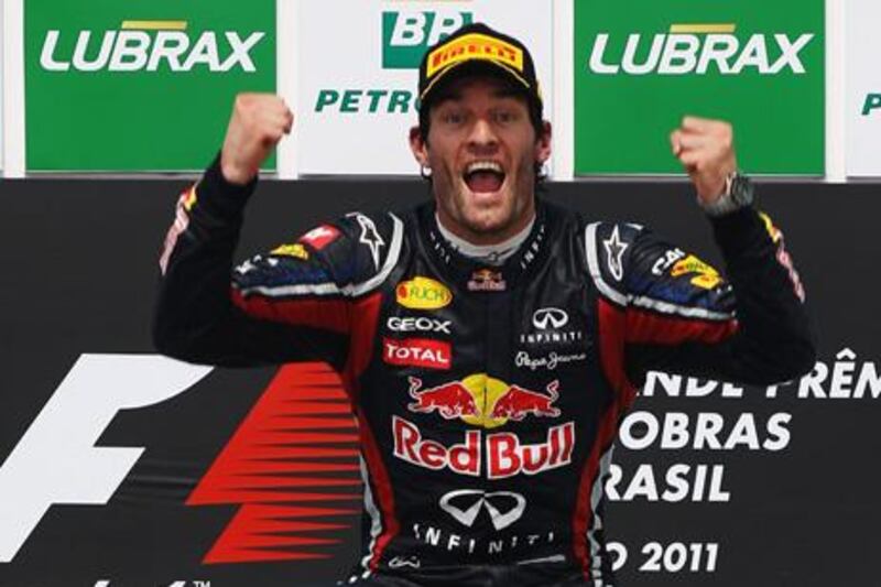 SAO PAULO, BRAZIL - NOVEMBER 27:  Mark Webber of Australia and Red Bull Racing celebrates on the podium after winning the the Brazilian Formula One Grand Prix at the Autodromo Jose Carlos Pace on November 27, 2011 in Sao Paulo, Brazil.  (Photo by Mark Thompson/Getty Images)