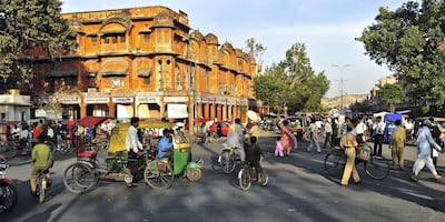 A busy Indian street scene in, Jaipur, Rajasthan, India. March 17, 2011