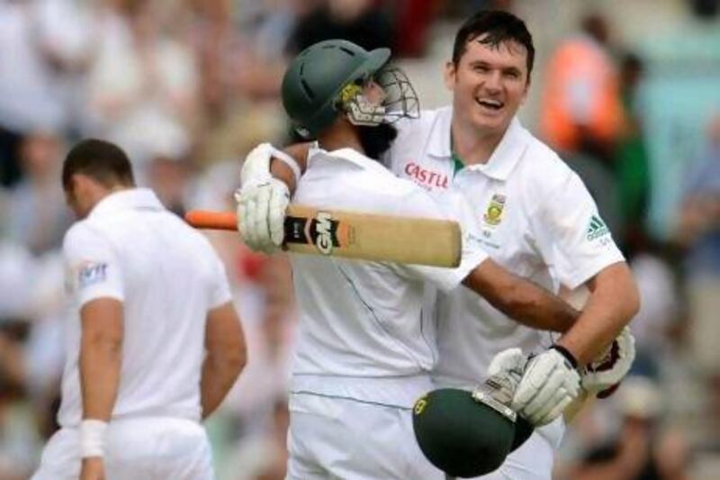 South Africa's captain Graeme Smith, right, has a habit of seeing off England captains. Philip Brown / Reuters