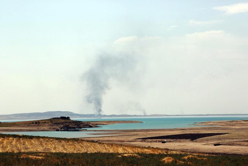 August 18, 2014: Smoke rising during airstrikes targeting ISIL at the Mosul Dam. AP Photo