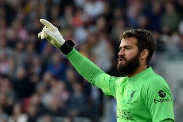 Liverpool's goalkeeper Alisson reacts during the English Premier League soccer match between Brentford and Liverpool at the Brentford Community Stadium in London, Saturday, Sept.  25, 2021.  (AP Photo / Rui Vieira)
