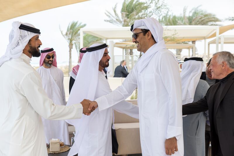 Qatar Emir Sheikh Tamim greets Maj Gen Sheikh Nasser bin Hamad, Bahrain's National Security Adviser
