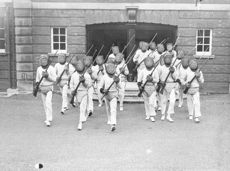 19th February 1938:  Army Cadets marching out of the gymnasium and preparing for Bayonet Fencing Drill at Sandhurst College.  (Photo by Fox Photos/Getty Images)