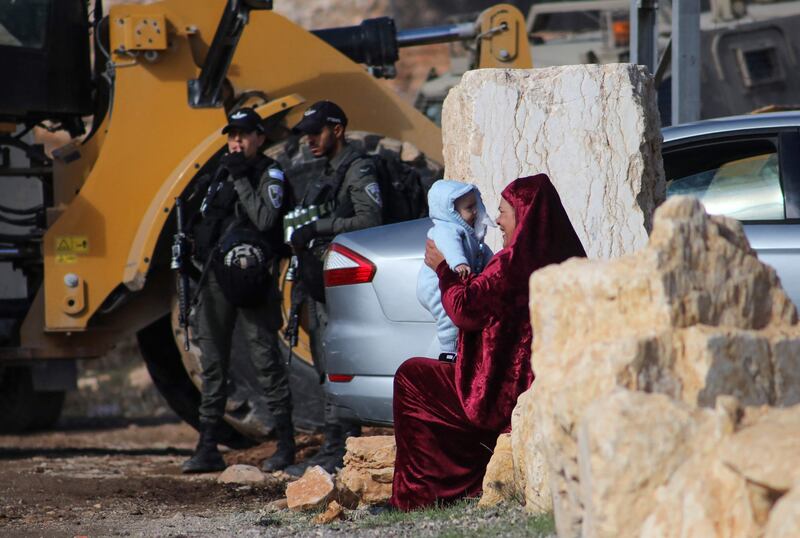 The Israeli army demolishes two Palestinian houses in the Jabal Johar area of the West Bank, near a settlement. AFP