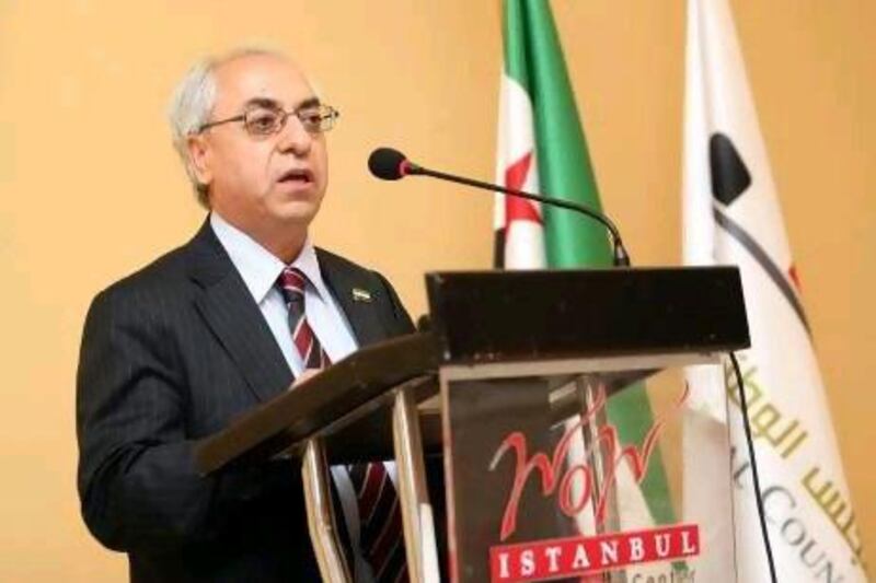 Abdel Basset Sayda, the new president of the Syrian National Council, speaks in Istanbul yesterday. Few activists or political analysts, let alone ordinary Syrians, had heard of Mr Sayda before his selection.