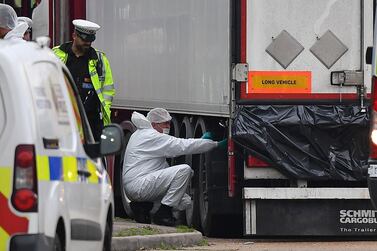 Police forensics officers examine the lorry in which 39 dead bodies were found. AFP / Ben STANSALL