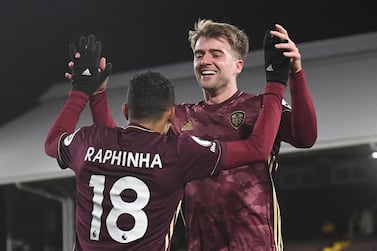 epa09084670 Leedsâ€™ Raphinha (L) celebrates with teammate Patrick Bamford (R) after scoring the 1-2 goal during the English Premier League soccer match between Fulham FC and Leeds United in London, Britain, 19 March 2021. EPA/Andy Rain / POOL EDITORIAL USE ONLY. No use with unauthorized audio, video, data, fixture lists, club/league logos or 'live' services. Online in-match use limited to 120 images, no video emulation. No use in betting, games or single club/league/player publications.