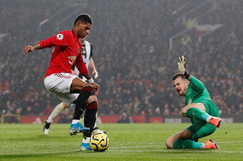 Manchester United's Marcus Rashford takes on Newcastle United's Martin Dubravka. Reuters