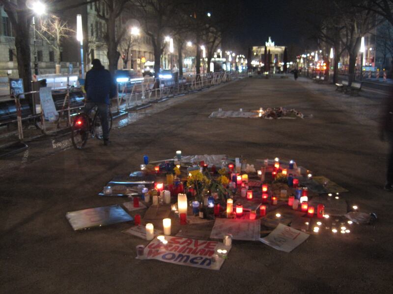 Candles and banners left as an anti-war protest in Berlin. Daniel Bardsley for The National
