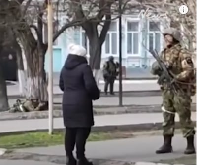 A video that went viral on social media shows a Ukrainian woman confronting a Russian solder and telling him to put sunflower seeds in his pocket. Photo: news.com.au