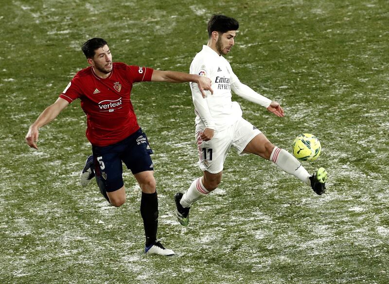 David Garcia competes with Real Madrid's striker Marco Asensio. EPA