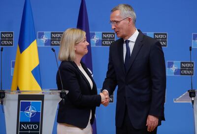 Sweden's Prime Minister Magdalena Andersson and Nato Secretary General Jens Stoltenberg shake hands at a joint press conference in Brussels. EPA