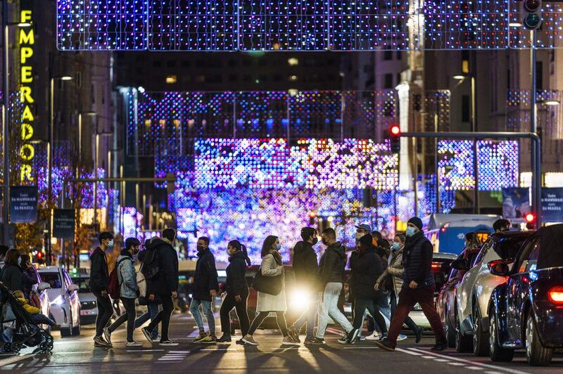 Pedestrians cross the Gran Via in Madrid, Spain. Bloomberg