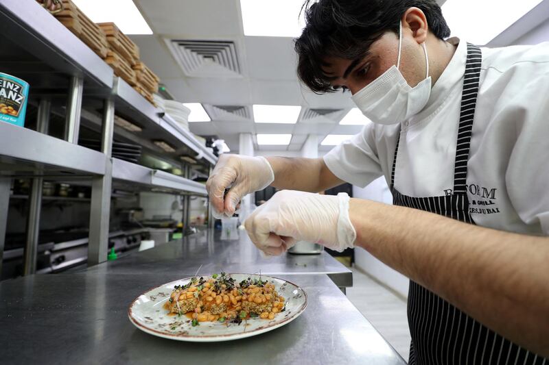Dubai, United Arab Emirates - Reporter: N/A. Lifestyle. Sous Chef Usama Shah prepares the baked beans of Weetabix. Reform Social & Grill have started seeing baked beans and wheetabix plus there own concoctions. Tuesday, February 16th, 2021. Dubai. Chris Whiteoak / The National