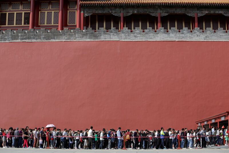 Tourists wait to visit the Forbidden City in central Beijing, China, on China's 68th National Day. Jason Lee / Reuters