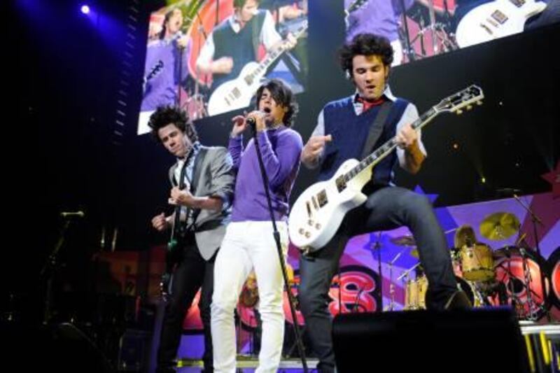 The Jonas Brothers, Nick, left, Kevin, center, and Joe, right, perform during Z100's Zooptopia '08 concert on Saturday night, May 17, 2008 at the Izod Center in East Rutherford, N.J.  (AP Photo/Bill Kostroun)