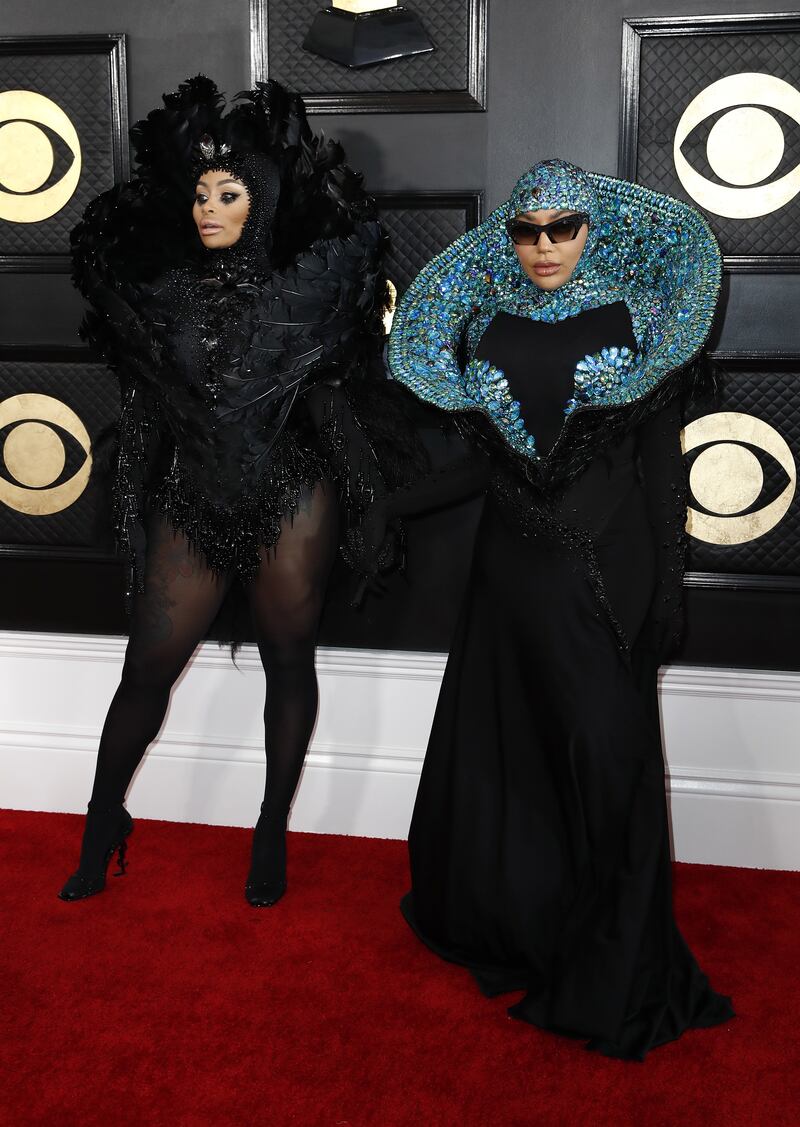 Blac Chyna, left, walks the red carpet with Cameroonian singer and fashion designer Dencia, both wearing custom bejewelled looks. EPA