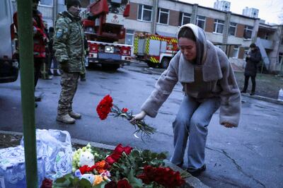 Flowers are left at the scene of a fatal helicopter crash near Kyiv. Reuters 