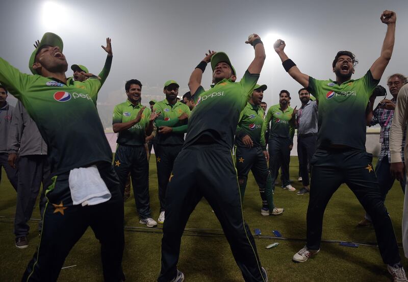 Pakistan's cricket team players celebrate after winning the third and final T20 cricket match against Sri Lanka, at the Gaddafi Cricket Stadium, in Lahore, on October 29, 2017.
Pakistan marked the return of Sri Lanka with a 3-0 Twenty20 series whitewash, as officials hoped it will help reestablish the country's reputation for hosting international cricket. / AFP PHOTO / AAMIR QURESHI