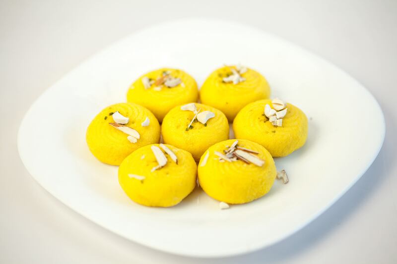 Peda, made from khoya and sugar, and garnished with pistachio and saffron. 