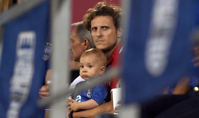 Diego Forlan looks on as he sits in the stands watching his Mumbai FC side in an Indian Super League semi-final match against Atletico de Kolkata at The Mumbai Football Arena Stadium on December 13, 2016. Indranil Mukherjee / AFP