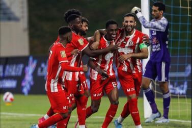 Al Jazira forward Ali Mabkhout, right, celebrates with teammates after scoring a penalty against Al Dhafra to break the UAE league goals record. Photo: PLC