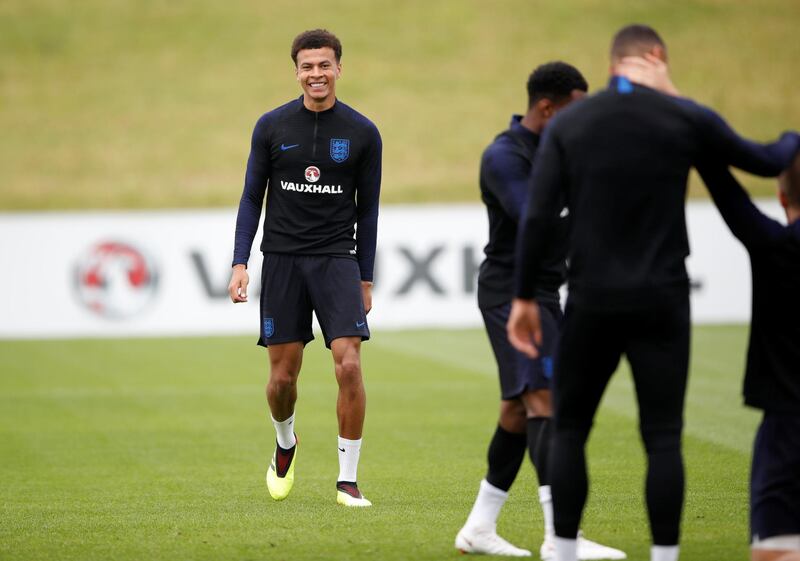 Dele Alli shares a joke during a training session at St Georges Park on May 28, 2018 in Burton-upon-Trent, England. Carl Recine / Reuters