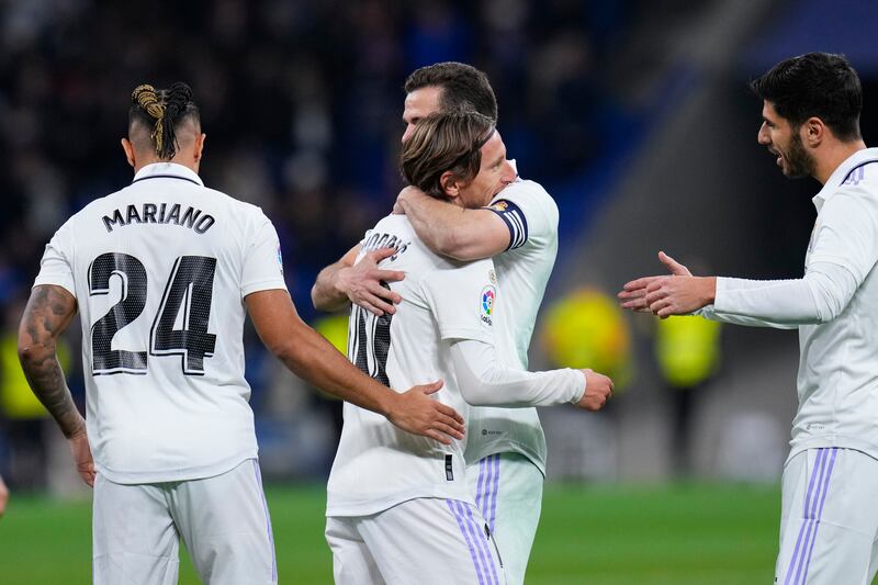 Real Madrid's Luka Modric, centre, is congratulated by teammates. AP Photo